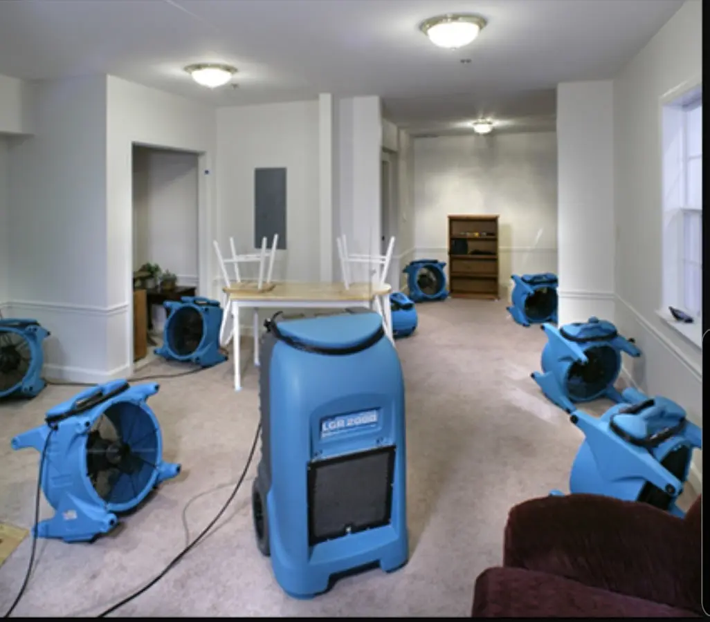 Air movers and dehumidifier setup for Water Damage Restoration in Delavan