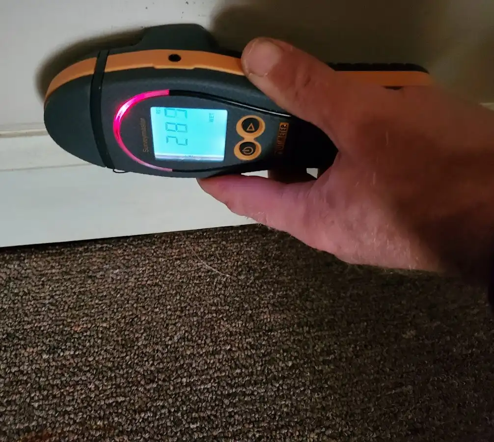 Moisture detection at baseboard during Storm Damage Restoration in Delavan